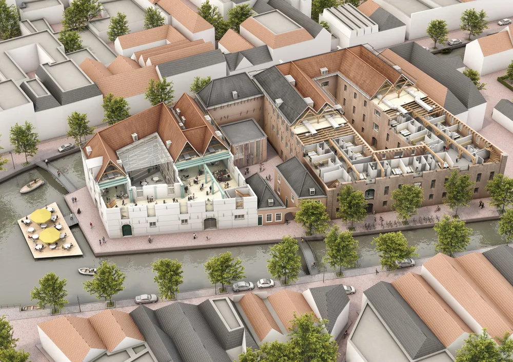 Luchtbeeld van het herontwikkelde Arsenaal Delft aan de gracht in de historische binnenstad